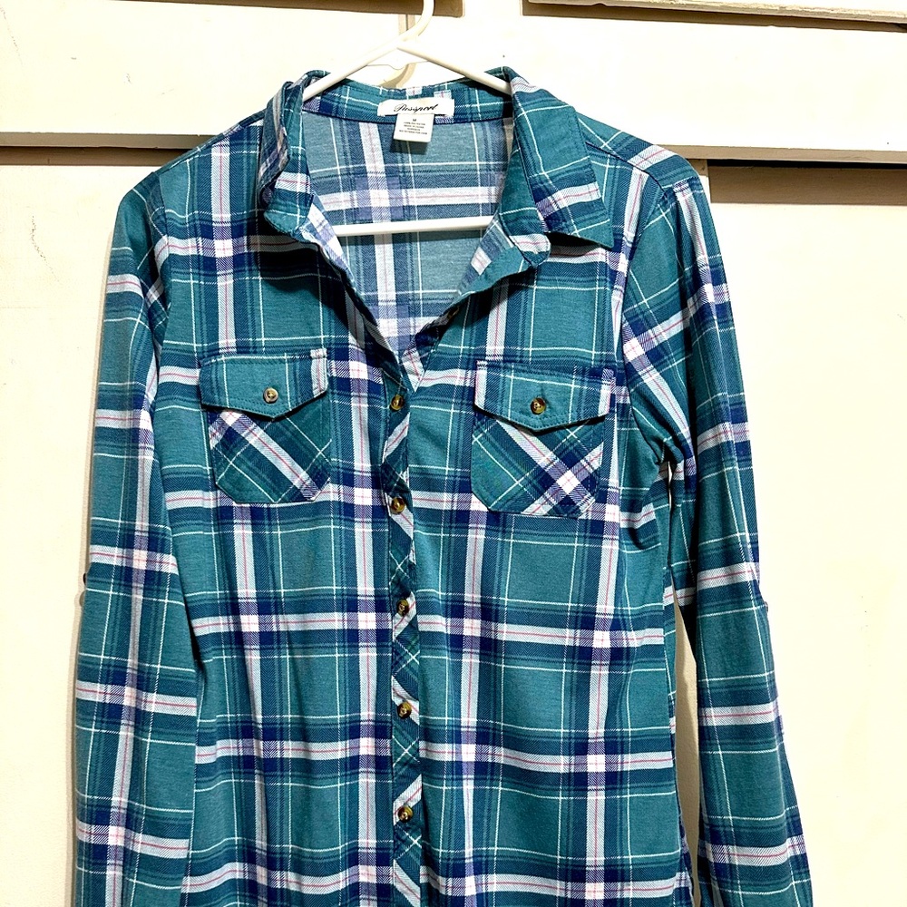 This is a size medium passport green shirt